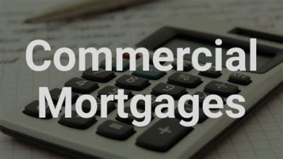 Calculator and documents with text 'Commercial Mortgages'.