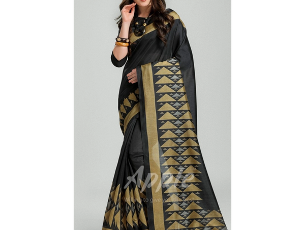 Woman wearing a black saree with golden geometric patterns.