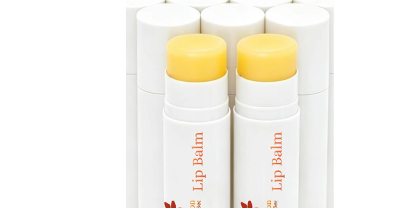 Two open lips balm sticks with white cases.
