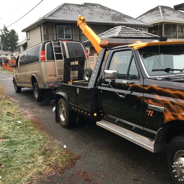 Our tow truck in action—towing a scrap van for eco-friendly removal in Richmond.  free service 