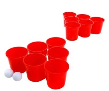 Red plastic cups arranged for a beer pong game with two white ping pong balls.