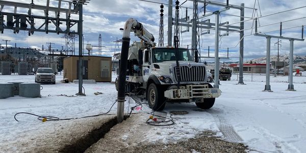 Hydrovac truck excavating a trench for a substation.