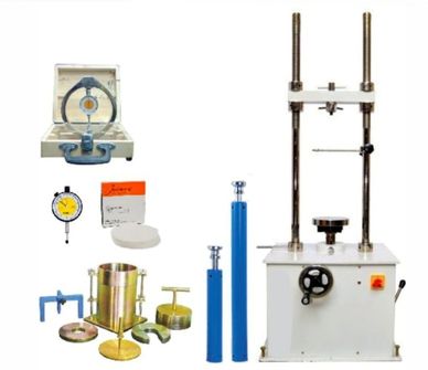 Concrete testing equipment including compression machine and molds.