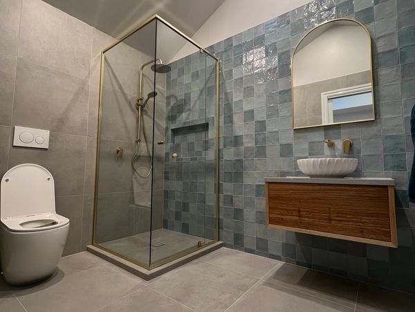 hand cut feature tile in ensuite bathroom with sky light