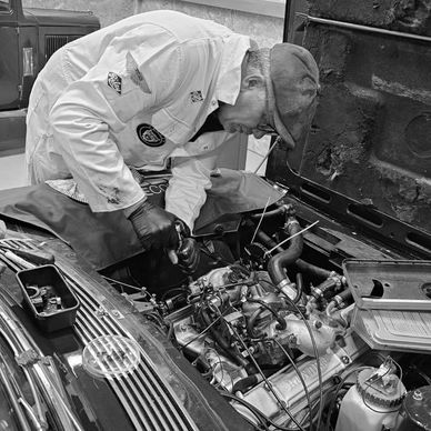 Our Ade checking and adjusting the valve clearances on a Triumph Stag.