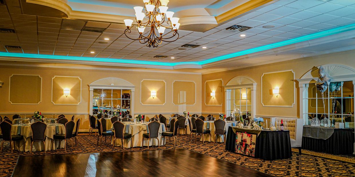 Elegant event venue with chandeliers and grand ballroom lighting