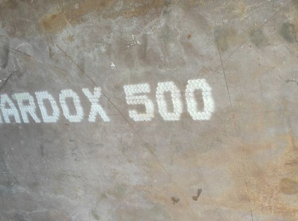 Close-up of a surface with 'ARDOX 500' text.