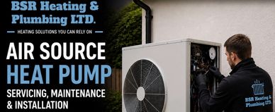 Technician servicing an air source heat pump by BSR Heating &amp; Plumbing LTD.