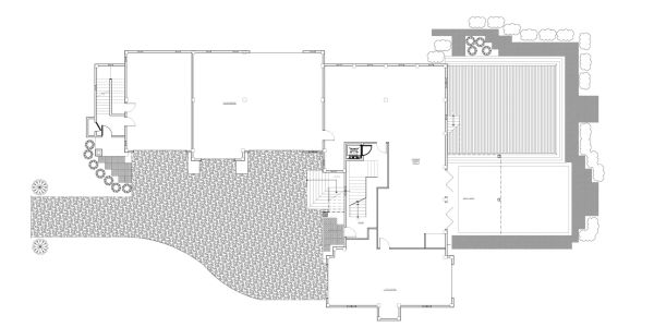 Architectural floor plan of a building with multiple rooms and outdoor areas.