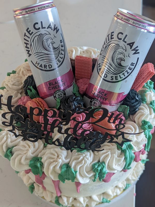 Custom Cake with white claw cans on top of the cake.