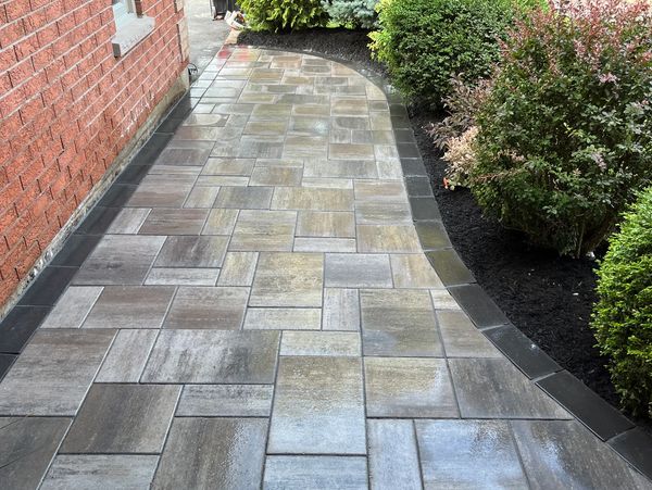 Stone pathway to front door designed and installed by Lay It Stone Scapes. 