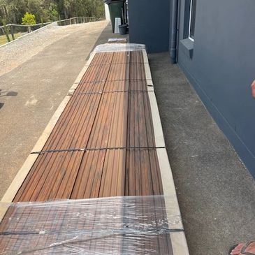 A pack of decking being delivered to a customer. 