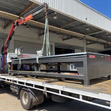 Crane ready to lift sandblast machinery. 