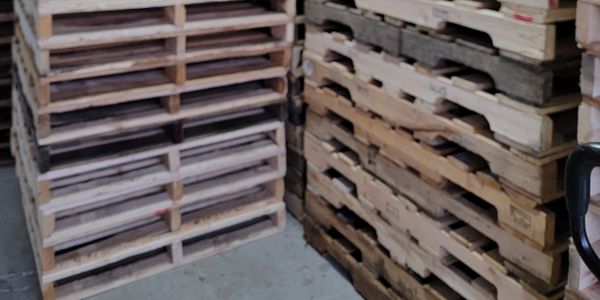 48x40 wooden pallets atored indoor  awaiting deliver good for medical and food transport 