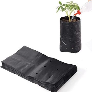 Black plastic grow bags with drainage holes for planting.