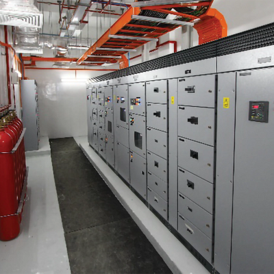 Industrial electrical control panels in a clean utility room.