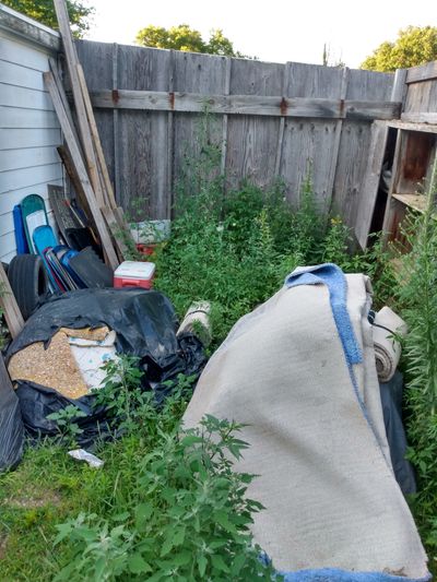 Junk Removal Dumpster rental trash haul away landscaper real estate for sale East Lansing Michigan