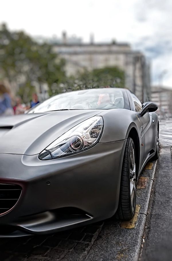 matte black Ferrari California on the Champs de Elise