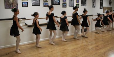 ballet students at the barre
