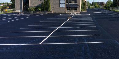 parking lot maintenance -sweeping , hot-melt crack repair , asphalt sealing , line painting