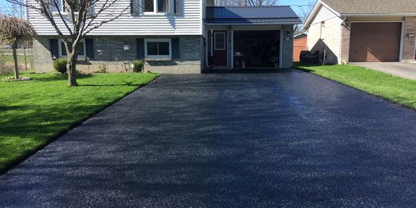 Residential driveway sealing right after completion. 