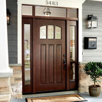 New hardwood entry door with glass both sides and top.