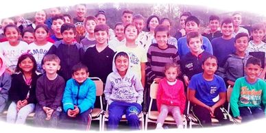 a group of children posing for a photo
