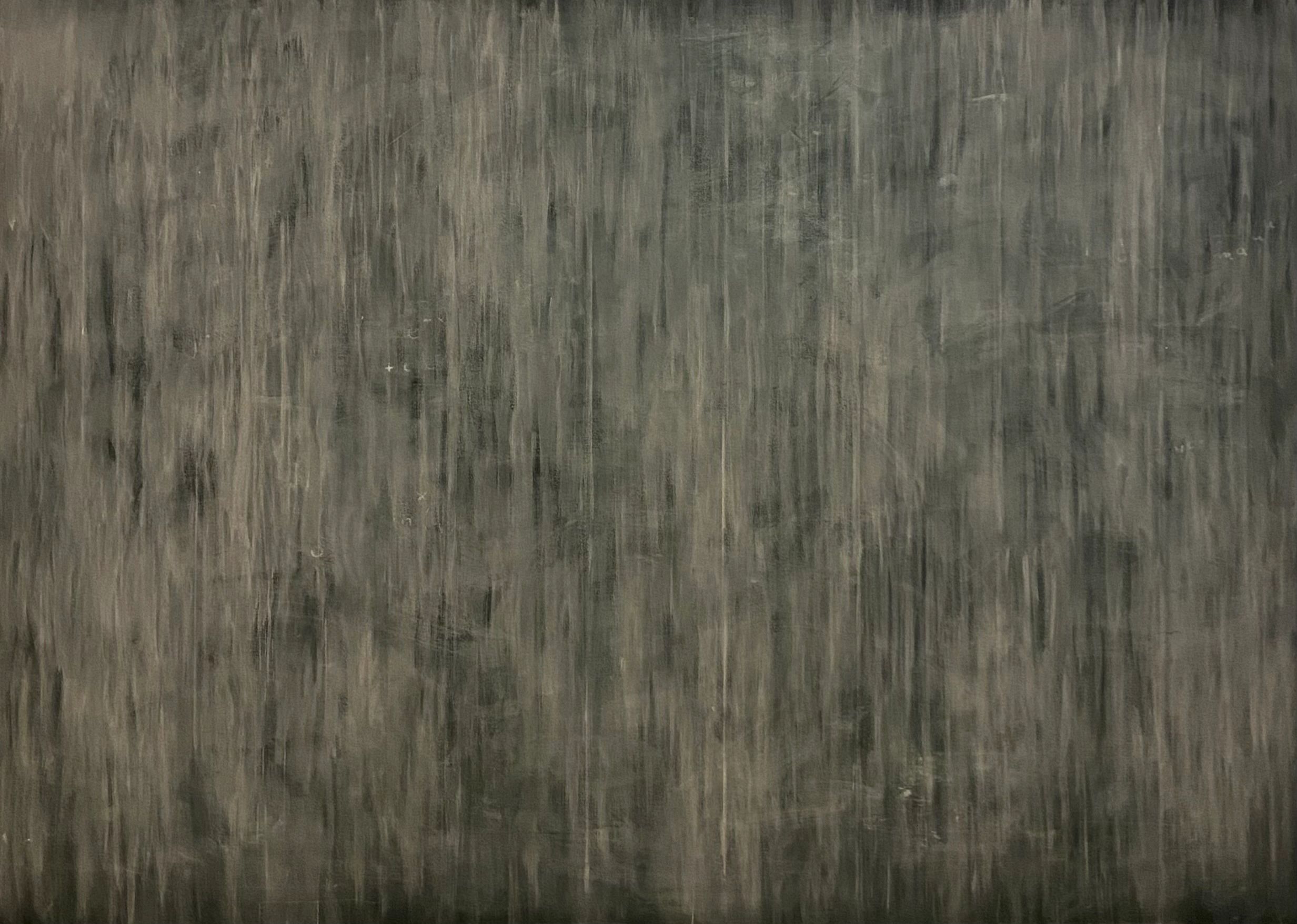 Gray textured surface with vertical streaks.