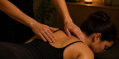 A woman receiving a back massage at Align Wellness Lab.