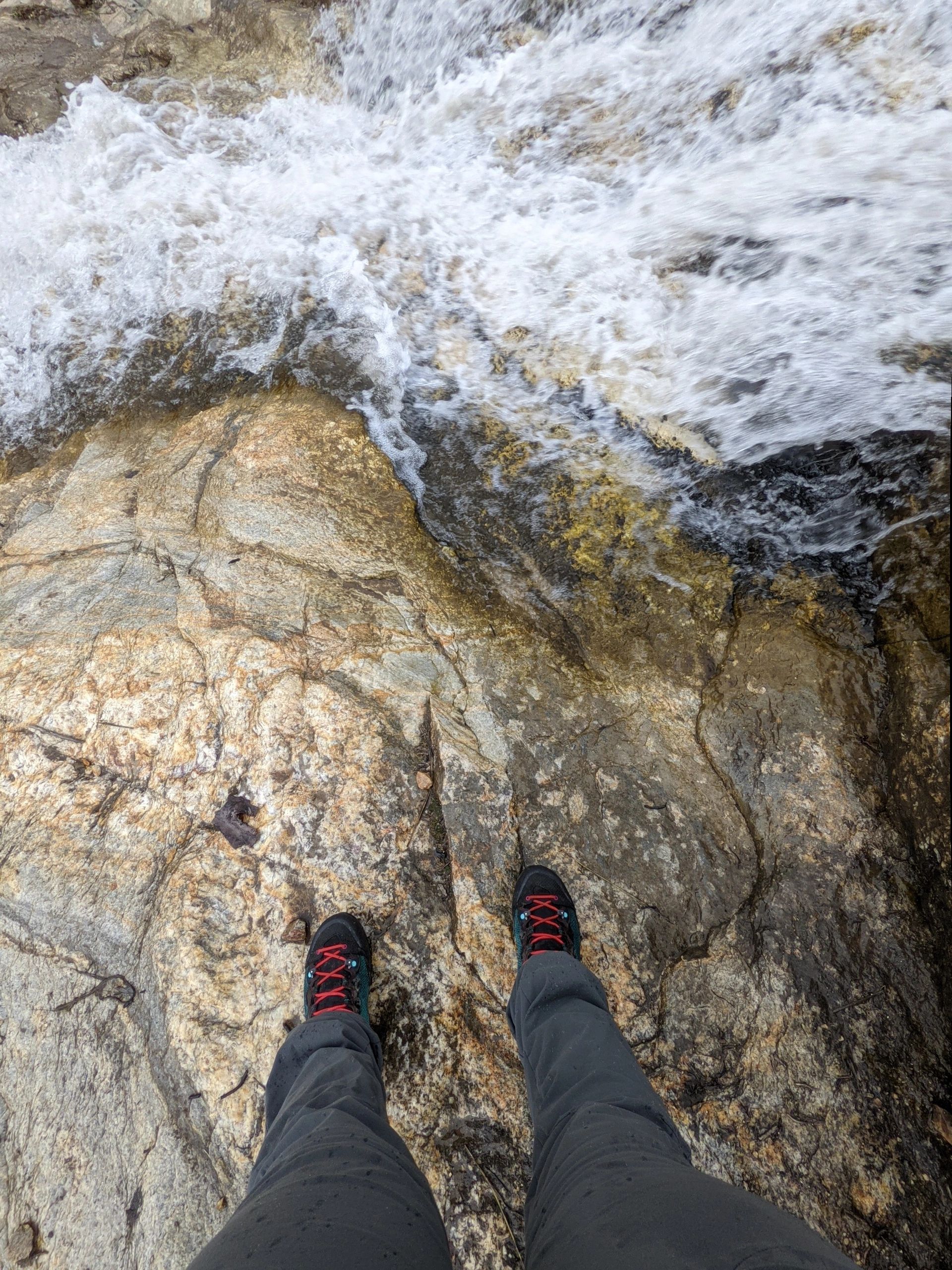 Backpacking in the high desert- with a rushing mountain waterfall and hiking boots in the picture.