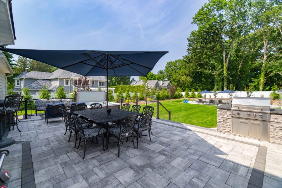 Paver patio with seat wall installed at a Huntington, Long Island home