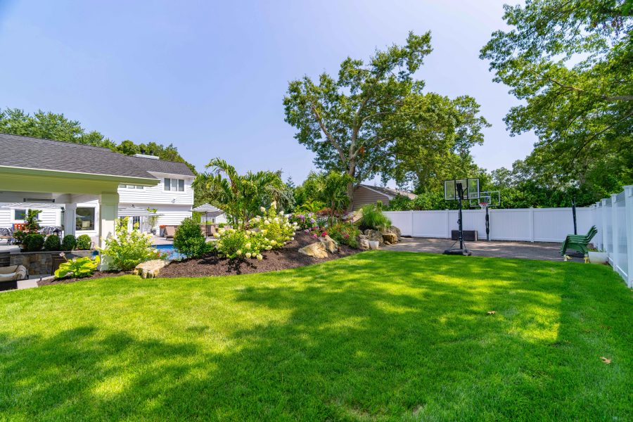 Regraded lawn and new planting beds finishing a whole-property renovation