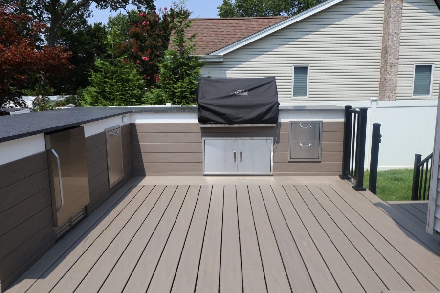 Built-in grill and stone outdoor kitchen on a Long Island patio