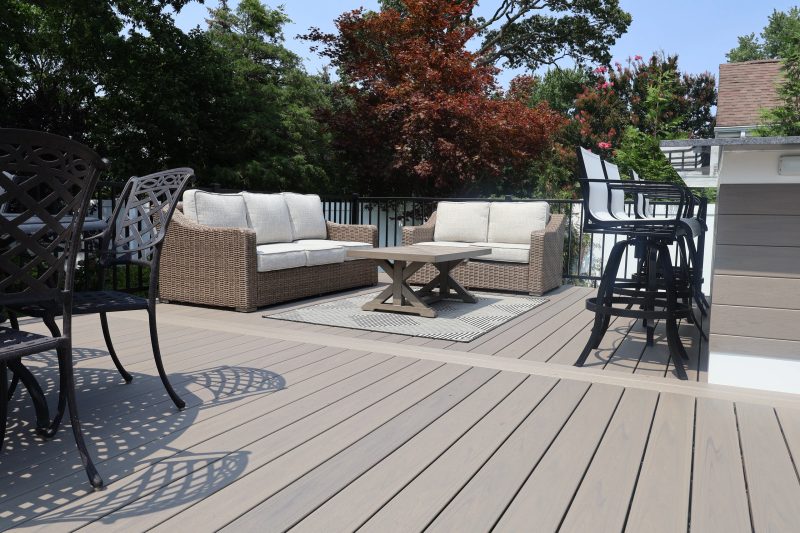 Custom deck adjoining an outdoor kitchen area
