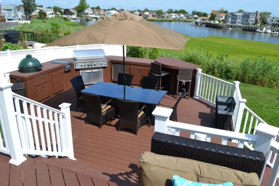 Waterfront deck with grill station and dining area