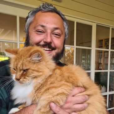 Dr Tom Kaczor holding a cat