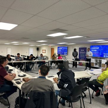 People in a leadership session in a conference room.