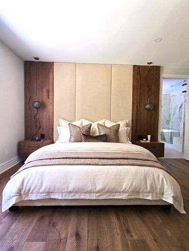 Modern bedroom with wood accents and neutral tones.
