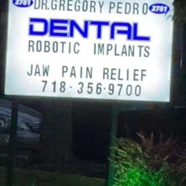 Sign from front lawn of About Face Dental Medi-Spa at 2781 Amboy Road Staten Island, NY 10306