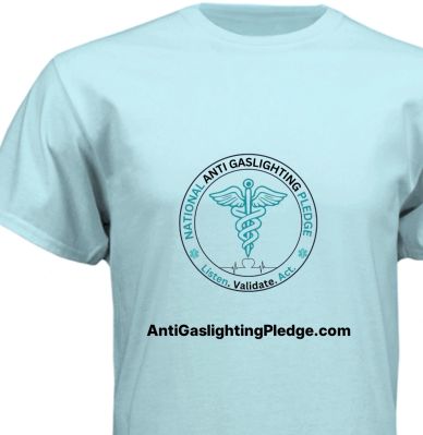 Light blue t-shirt with National Anti Gaslighting Pledge logo and website address.