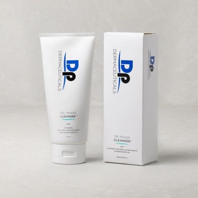 Dermaceuticals Tri-Phase Cleanser with packaging on a gray surface.