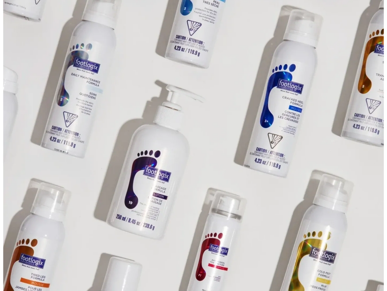 Various Footlogix foot care products arranged on a white surface.