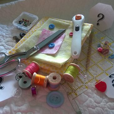 A serene landscape featuring a calm lake surrounded by mountains under a clear blue sky.