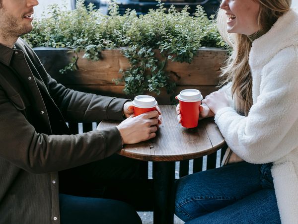 Speed Dating Couple Introducing Themselves Over Coffee