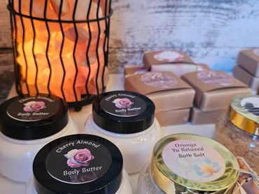 Cherry Almond body butter and Orange Ya Relaxed bath salt with warm glowing decor.