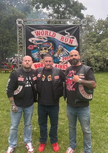 Three men in biker vests at the 43rd World Run Buenos Aires event.