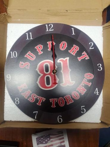 Round clock with 'Support 81 East Toronto' design.