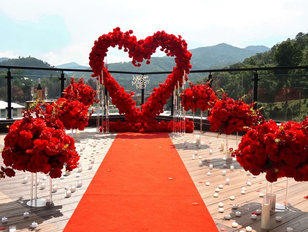 Red heart-shaped floral arrangement for proposal.