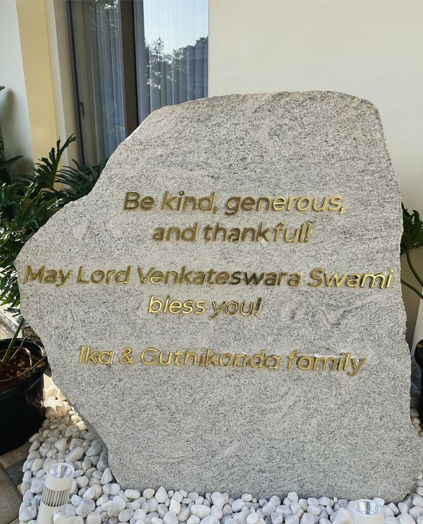 Inspirational message engraved on a stone, blessing from Lord Venkateswara Swami.