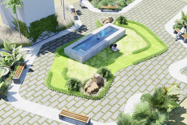 Modern courtyard with a rectangular fountain and greenery surrounded by benches.